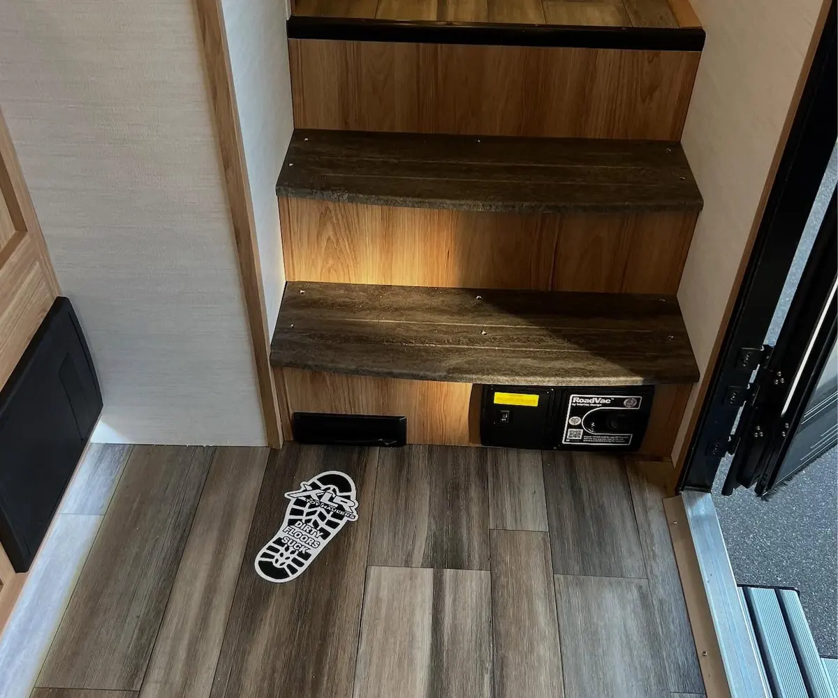 A VacPort sweep inlet installed at floor level